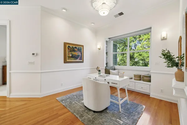 a living room with furniture and a lamp