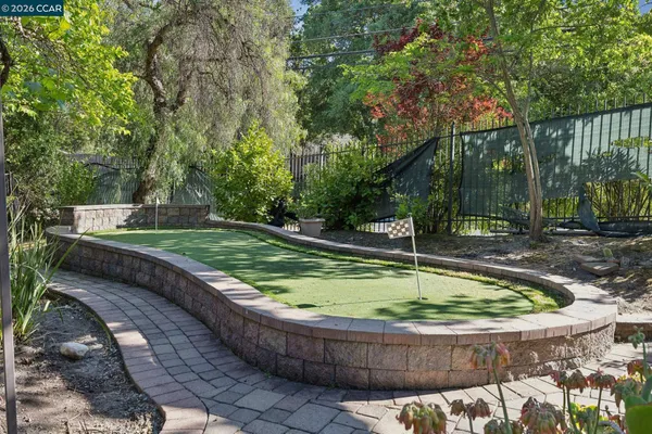 a backyard of a house with outdoor seating