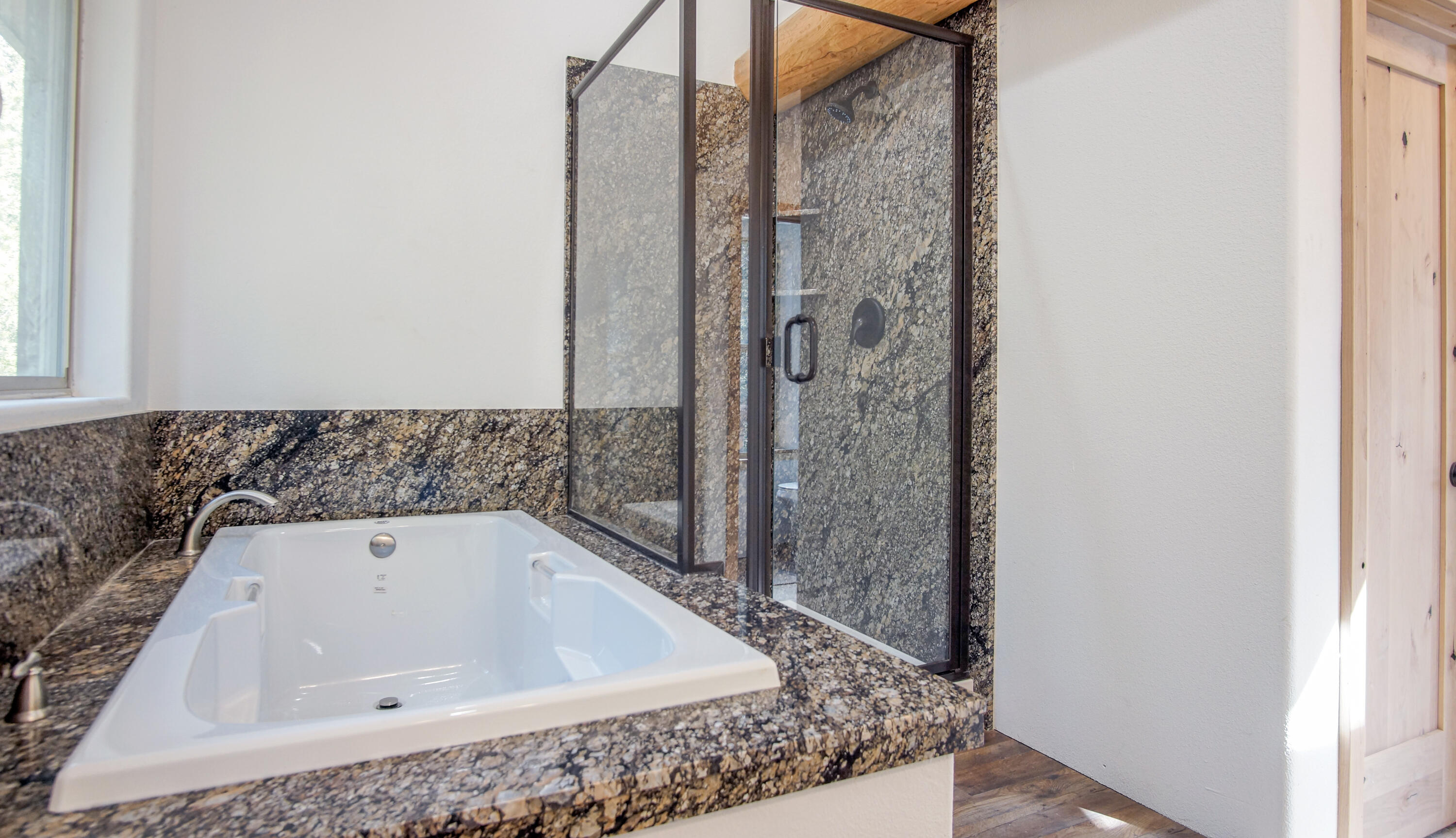 8118 Pine Forest Road Shingletown, CA 96088 - Photo 22 of 38 a bathroom with a bathtub