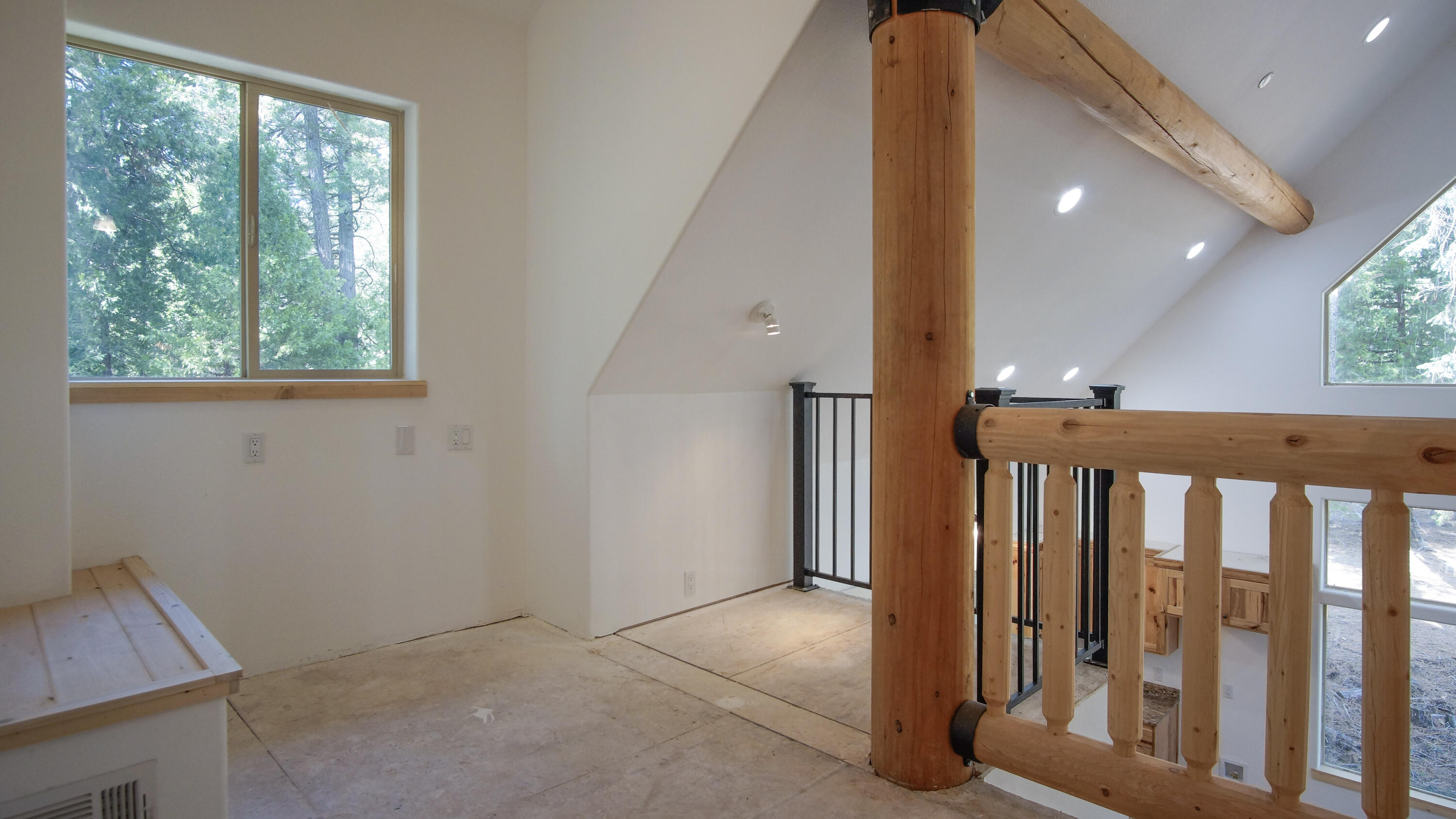 8118 Pine Forest Road Shingletown, CA 96088 - Photo 26 of 38 a view of a hallway with a window and wooden floor