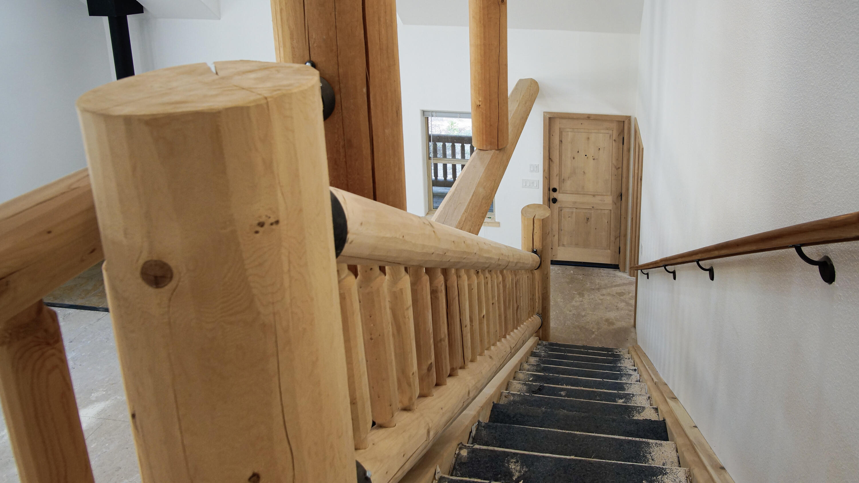 8118 Pine Forest Road Shingletown, CA 96088 - Photo 27 of 38 a view of hallway with stairs and wooden floor