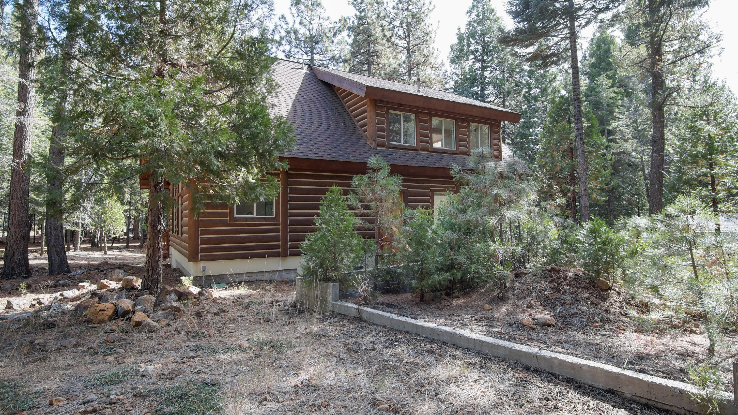 8118 Pine Forest Road Shingletown, CA 96088 - Photo 35 of 38 a view of a house with a yard