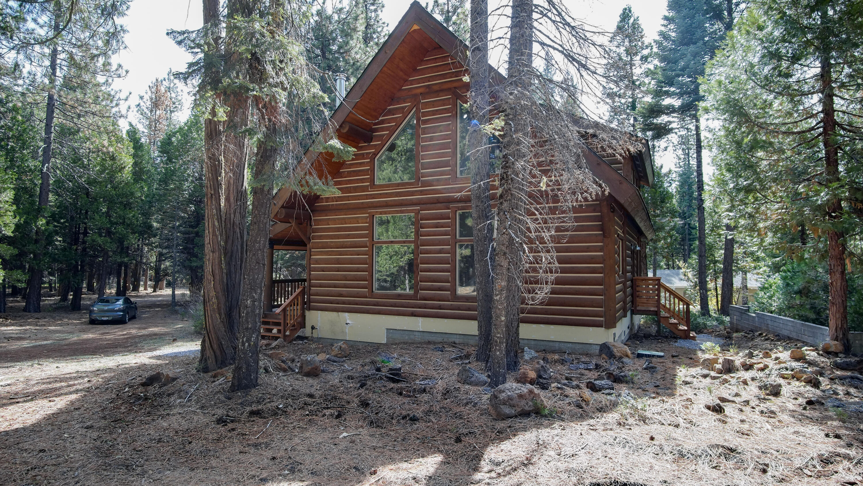 8118 Pine Forest Road Shingletown, CA 96088 - Photo 37 of 38 a backyard of a house with lots of green space