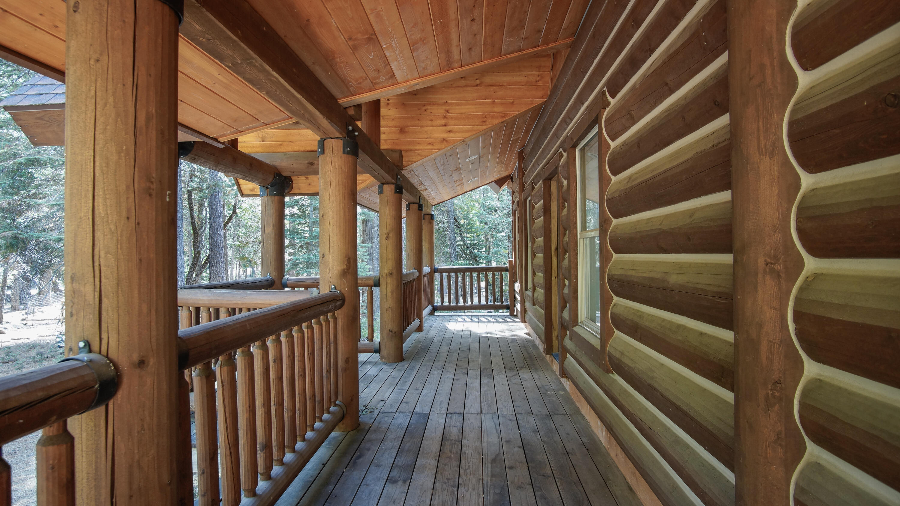8118 Pine Forest Road Shingletown, CA 96088 - Photo 4 of 38 a view of hallway with wooden floor and door