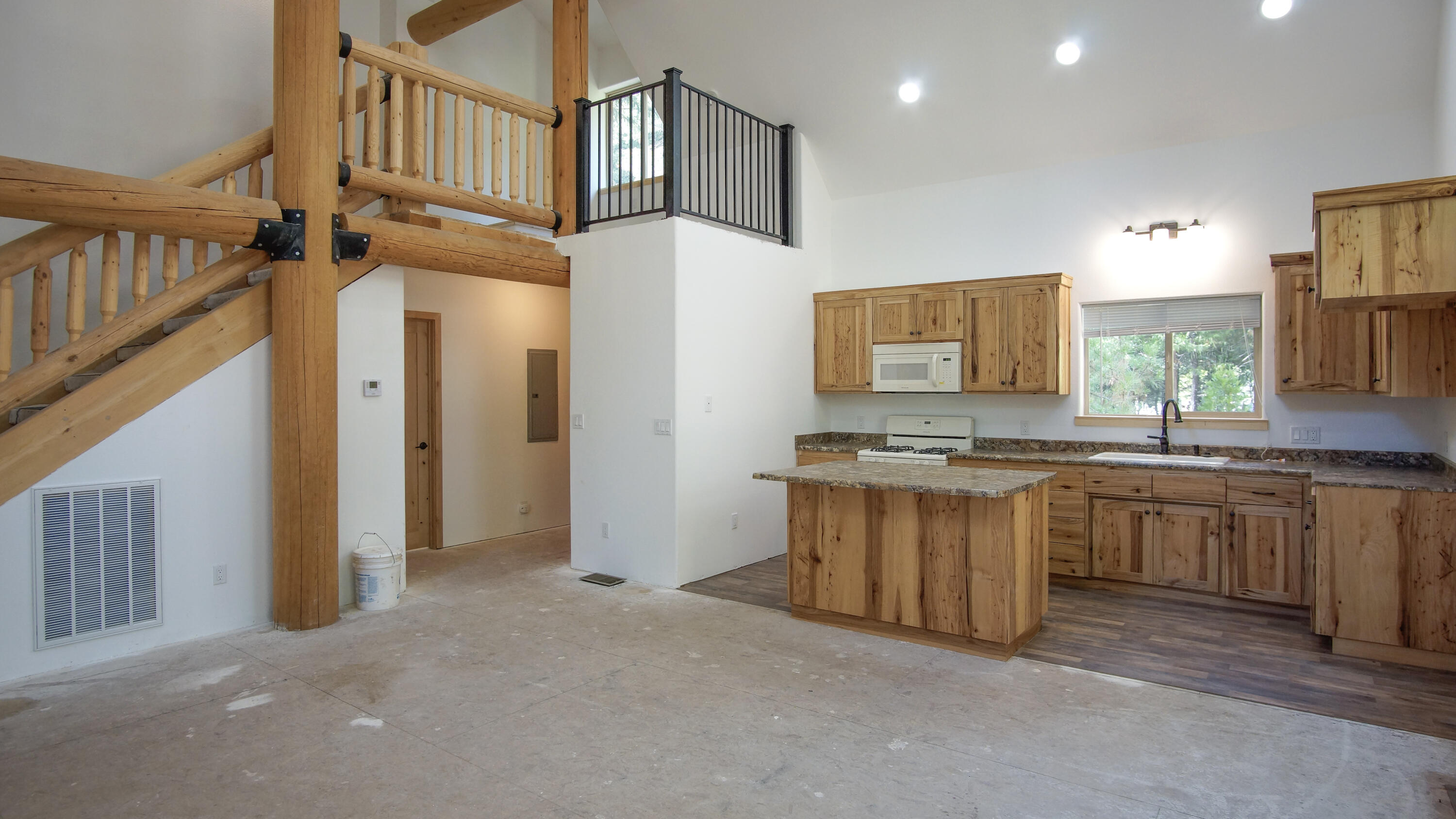 8118 Pine Forest Road Shingletown, CA 96088 - Photo 5 of 38 a view of a kitchen with stainless steel appliances granite countertop a refrigerator a sink and a stove top oven