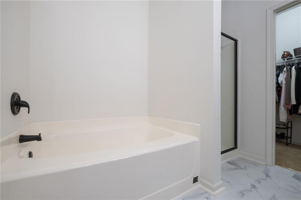 3950 Cyrus Crest Circle Northwest Kennesaw, GA 30152 - Photo 20 of 44 a bathroom with a bathtub