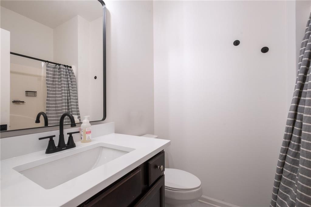 3950 Cyrus Crest Circle Northwest Kennesaw, GA 30152 - Photo 24 of 44 a bathroom with a sink and a toilet