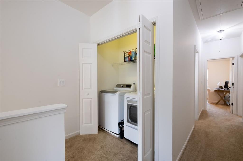 3950 Cyrus Crest Circle Northwest Kennesaw, GA 30152 - Photo 33 of 44 a view of a hallway with living room and utility room