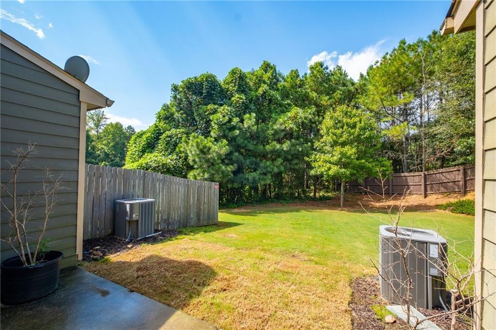3950 Cyrus Crest Circle Northwest Kennesaw, GA 30152 - Photo 37 of 44 a view of a backyard with plants and tree
