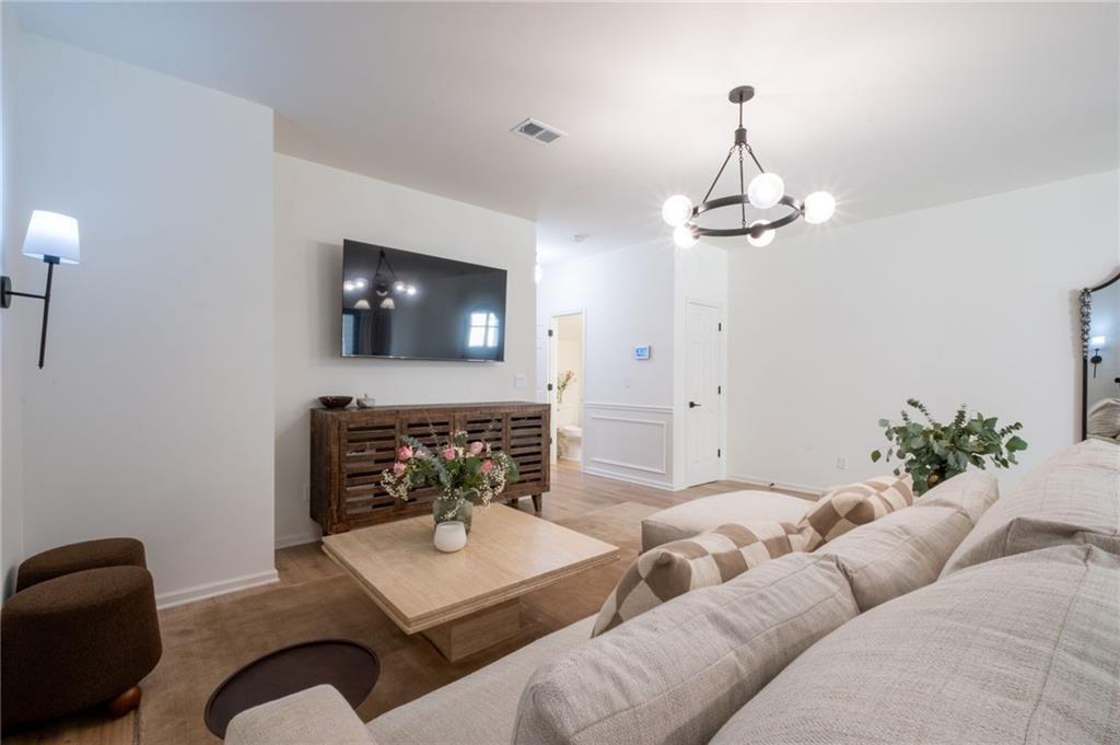 3950 Cyrus Crest Circle Northwest Kennesaw, GA 30152 - Photo 43 of 44 a living room with furniture and a fireplace