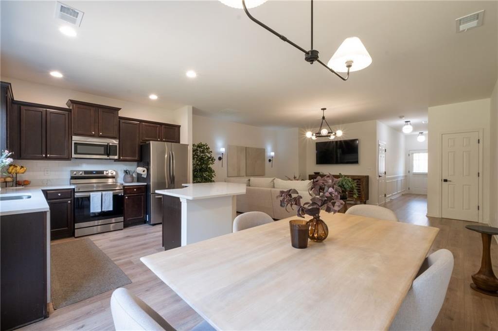 3950 Cyrus Crest Circle Northwest Kennesaw, GA 30152 - Photo 44 of 44 a kitchen with sink a refrigerator and microwave