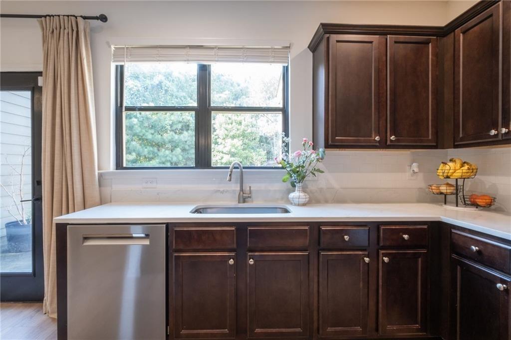 3950 Cyrus Crest Circle Northwest Kennesaw, GA 30152 - Photo 8 of 44 a kitchen with a sink a window and potted plant