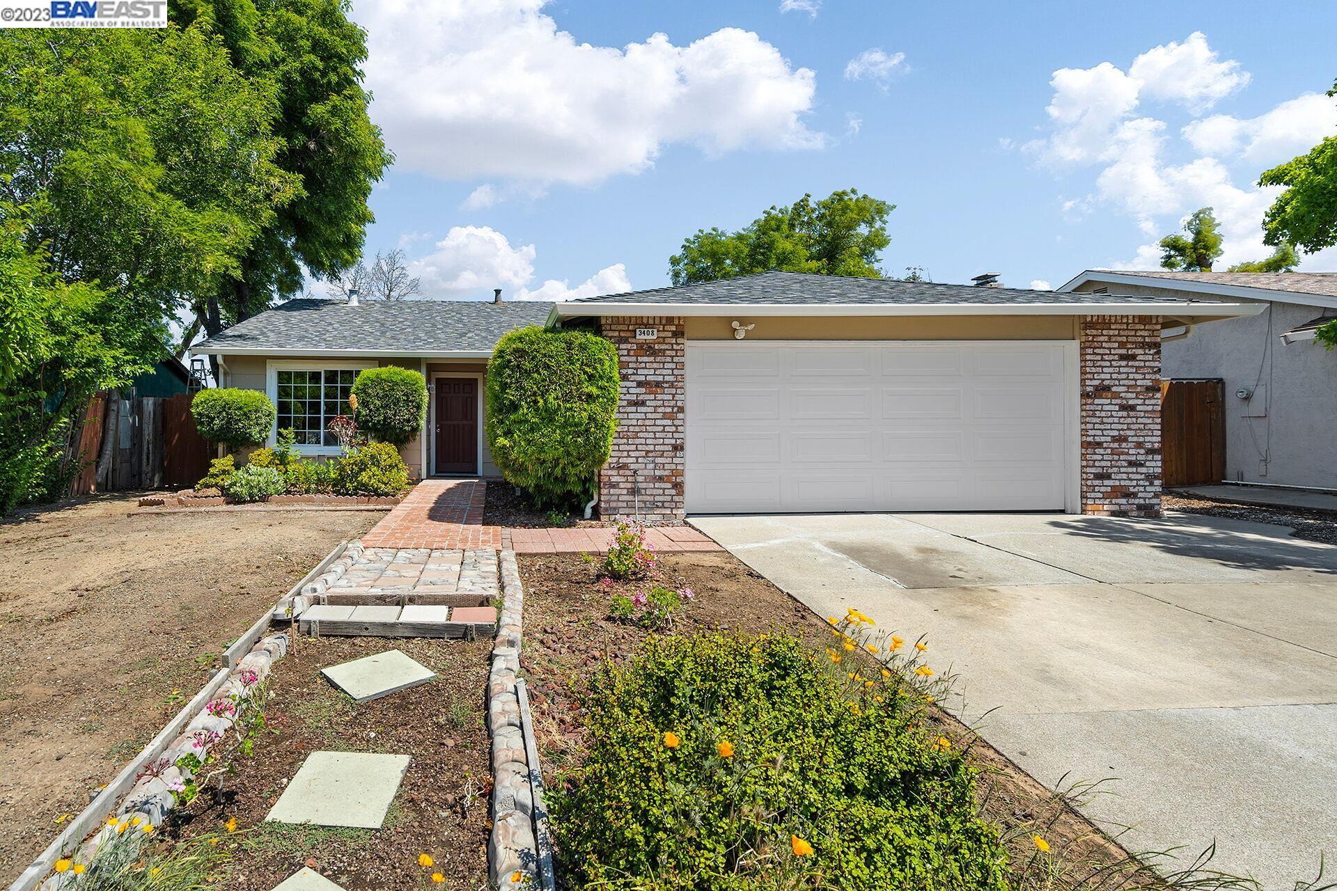 3408 Gregory Drive Bay Point, CA 94565 - Photo 1 of 1 a front view of a house with a yard and garage