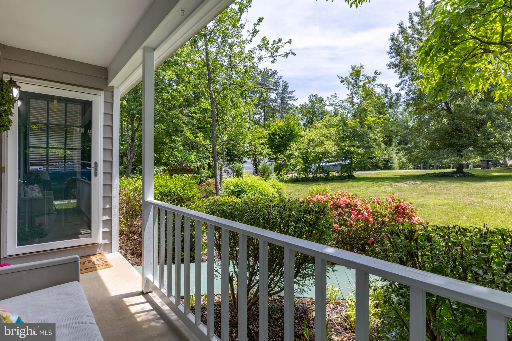 164 Oliver Lane Ruckersville, VA 22968 - Photo 33 of 39 Serene porch with lush greenery.