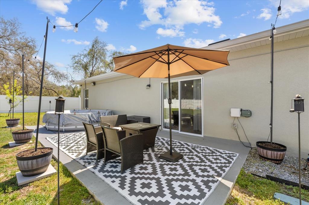 13657 Southwest 33rd Circle Ocala, FL 34473 - Photo 17 of 26 a view of a roof deck with table and chairs