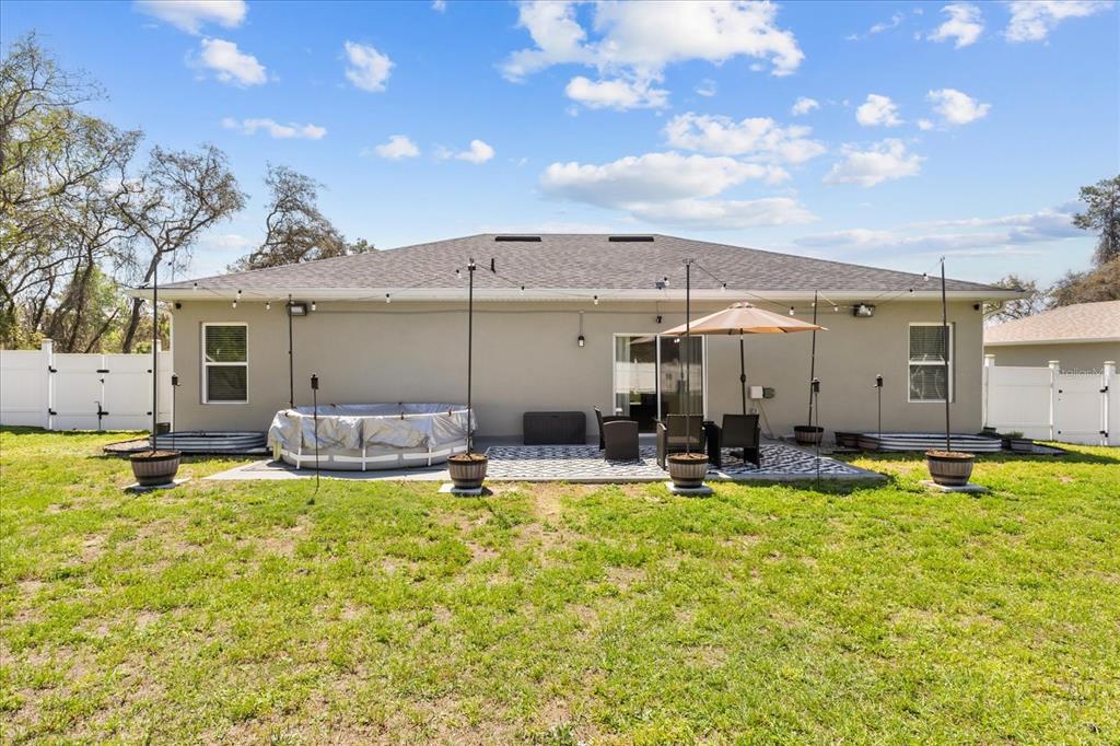 13657 Southwest 33rd Circle Ocala, FL 34473 - Photo 18 of 26 a view of a house with swimming pool and sitting area