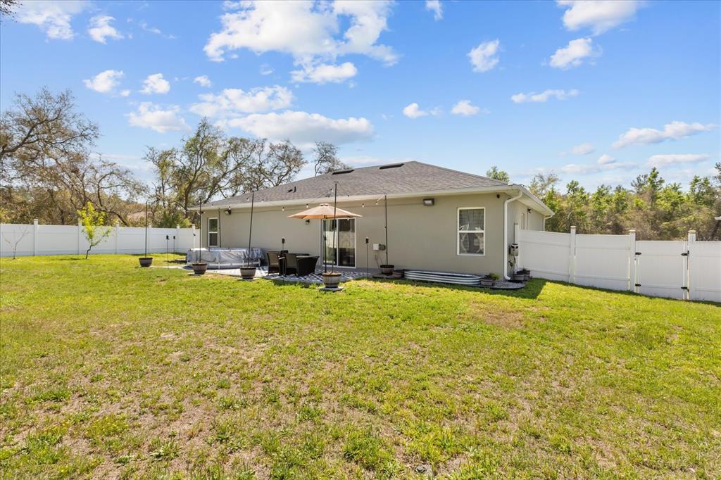 13657 Southwest 33rd Circle Ocala, FL 34473 - Photo 19 of 26 a view of outdoor space yard and patio