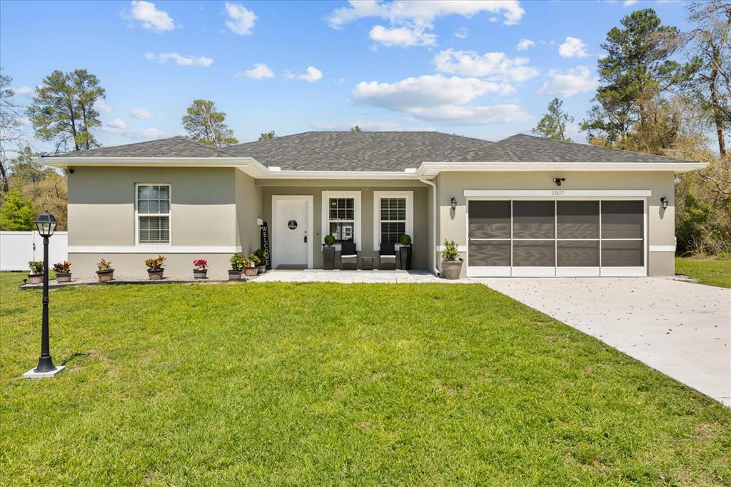 13657 Southwest 33rd Circle Ocala, FL 34473 - Photo 23 of 26 a view of a house with a backyard