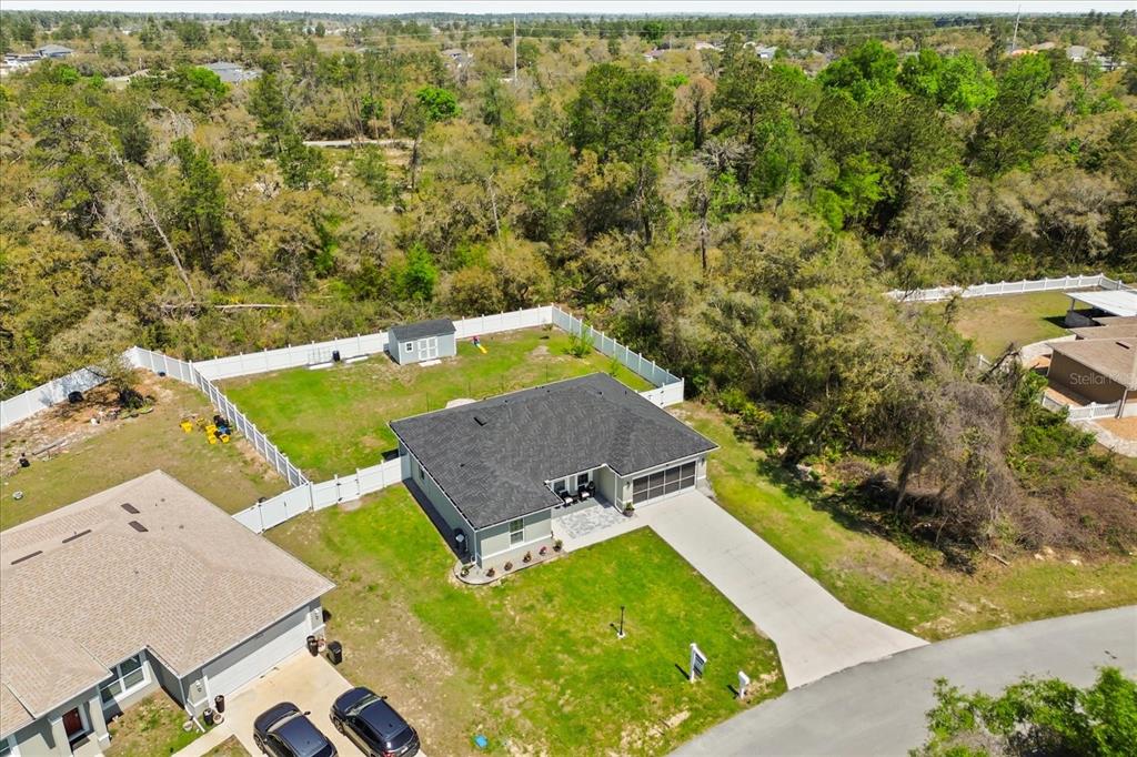 13657 Southwest 33rd Circle Ocala, FL 34473 - Photo 24 of 26 an aerial view of a house with a yard