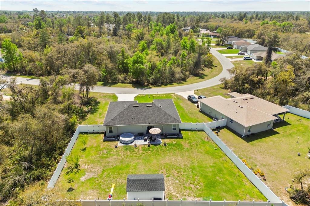 13657 Southwest 33rd Circle Ocala, FL 34473 - Photo 25 of 26 an aerial view of a house with swimming pool