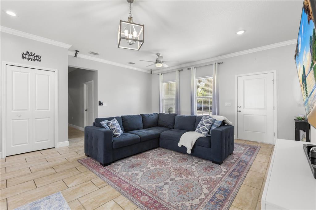 13657 Southwest 33rd Circle Ocala, FL 34473 - Photo 8 of 26 a living room with furniture and a rug