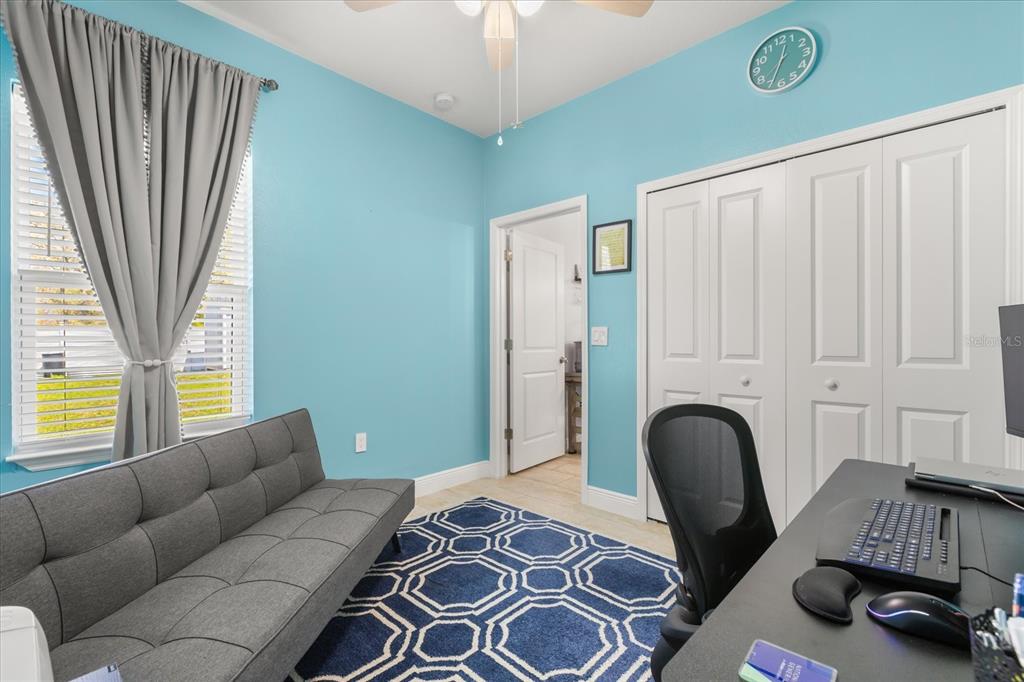 13657 Southwest 33rd Circle Ocala, FL 34473 - Photo 10 of 26 a bedroom with furniture and a window