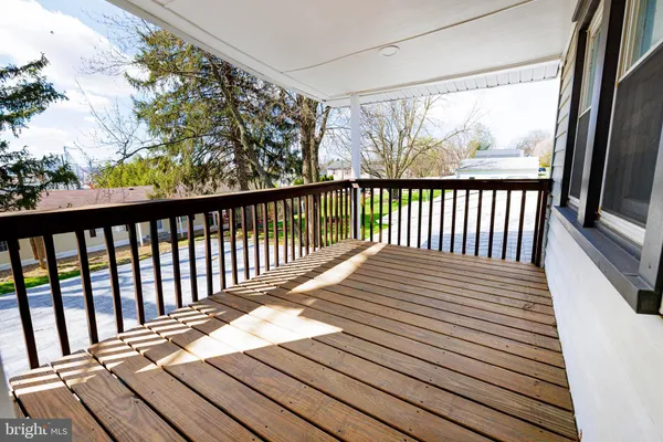 a view of balcony with wooden floor