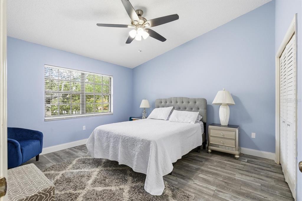2178 Elm Street, Unit 1007 Dunedin, FL 34698 - Photo 15 of 28 a bedroom with a bed and a large window