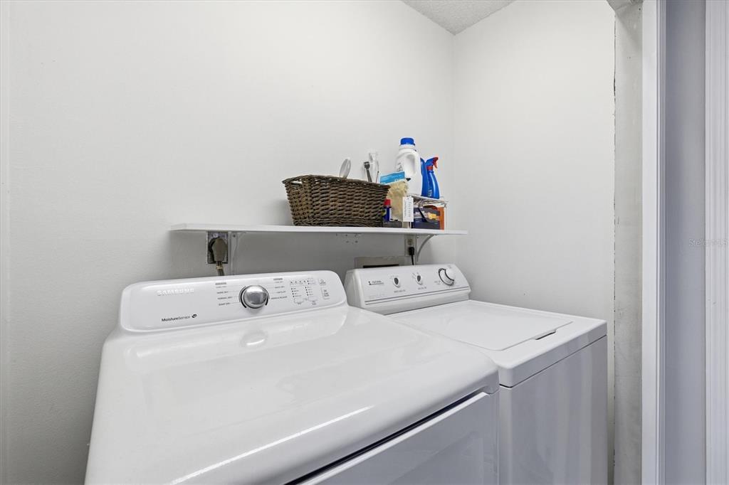 2178 Elm Street, Unit 1007 Dunedin, FL 34698 - Photo 22 of 28 a utility room with dryer and washer