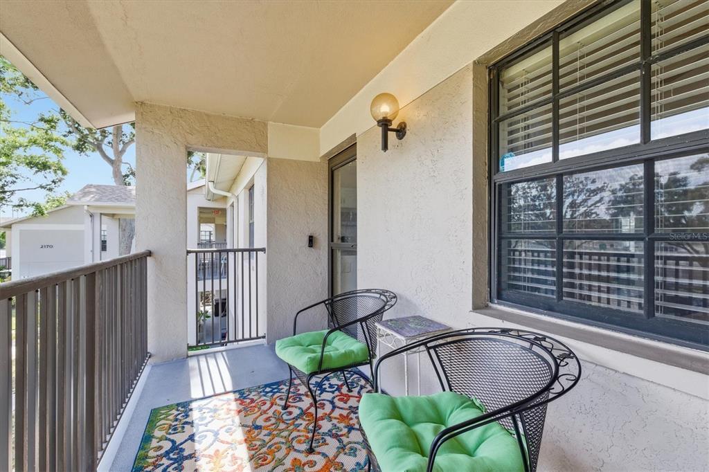 2178 Elm Street, Unit 1007 Dunedin, FL 34698 - Photo 5 of 28 a living room with furniture and a window