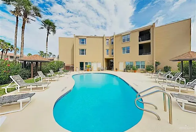 a view of a swimming pool with chairs