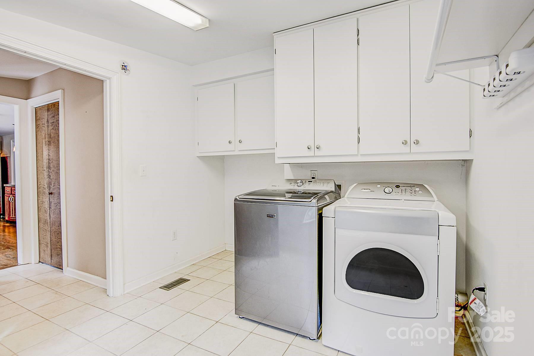 5165 Woodleaf Road Salisbury, NC 28147 - Photo 19 of 48 a utility room with dryer and washer
