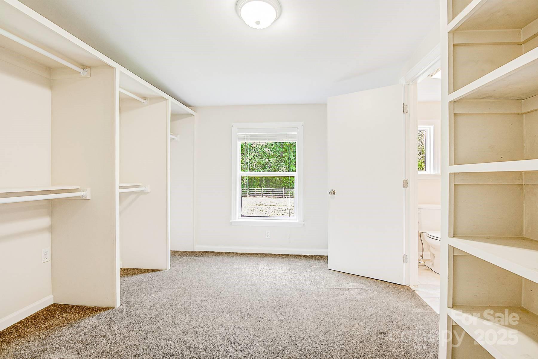5165 Woodleaf Road Salisbury, NC 28147 - Photo 32 of 48 a view of an empty room with a window