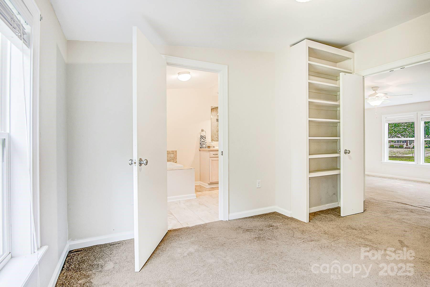 5165 Woodleaf Road Salisbury, NC 28147 - Photo 34 of 48 a view of room with walk in closet and bedroom
