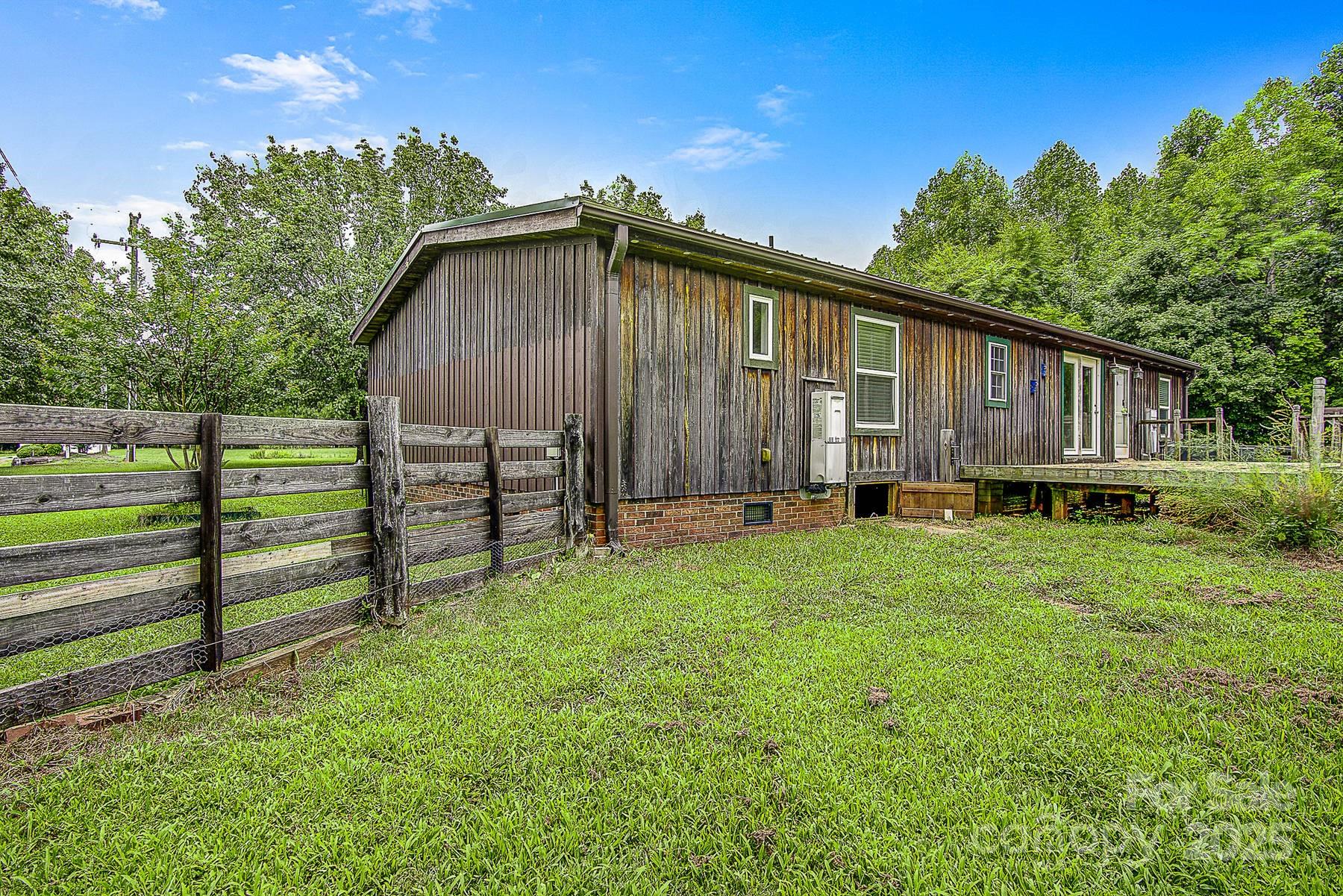 5165 Woodleaf Road Salisbury, NC 28147 - Photo 42 of 48 a view of a house with backyard and sitting area
