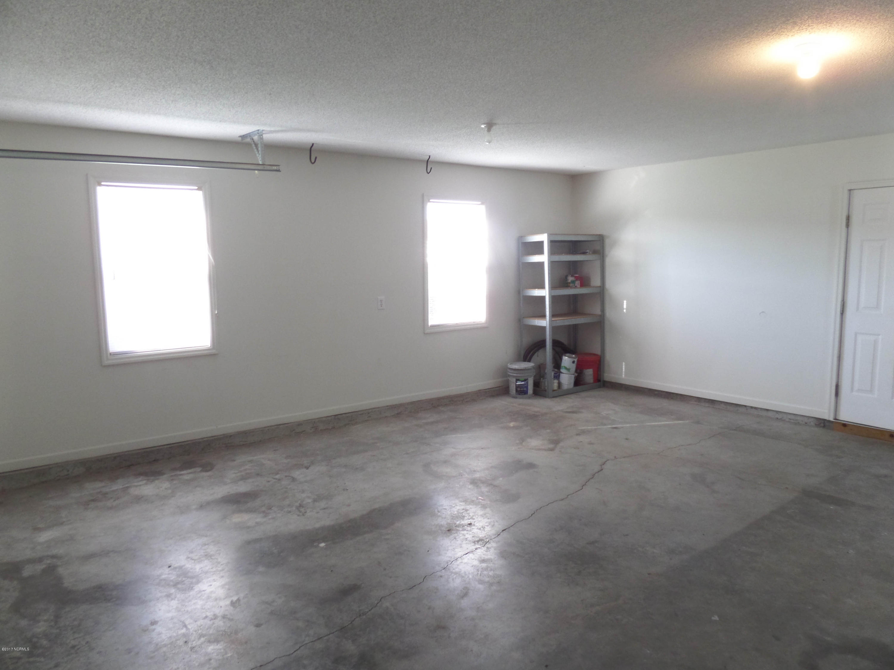 401 Sumrell Way Hubert, NC 28539 - Photo 24 of 26 Over-sized garage with windows