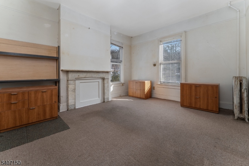 50 Drakestown Road Hackettstown, NJ 07840 - Photo 11 of 47 a view of an empty room with a fireplace and window