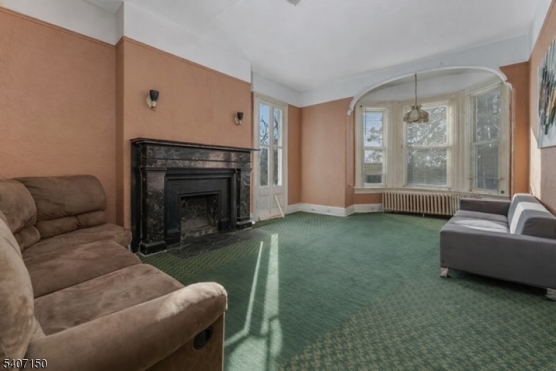 50 Drakestown Road Hackettstown, NJ 07840 - Photo 12 of 47 a living room with furniture and a fireplace