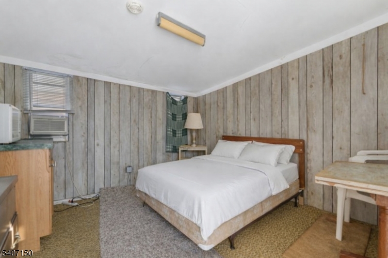 50 Drakestown Road Hackettstown, NJ 07840 - Photo 24 of 47 a bedroom with a bed and a refrigerator