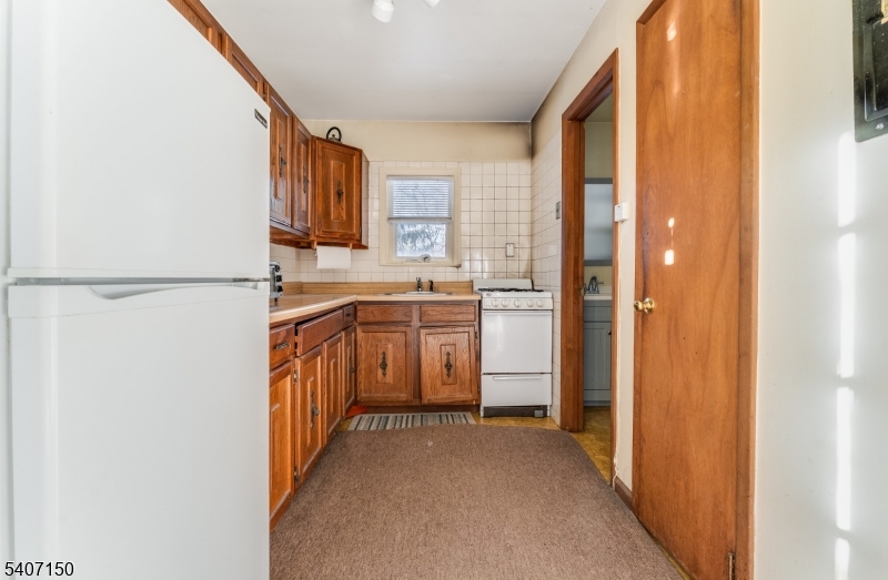50 Drakestown Road Hackettstown, NJ 07840 - Photo 31 of 47 a kitchen with a refrigerator a sink and a window