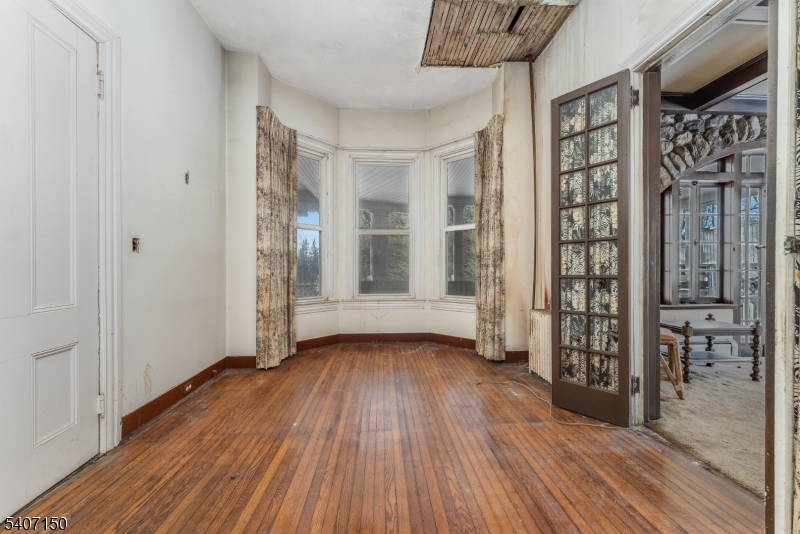50 Drakestown Road Hackettstown, NJ 07840 - Photo 4 of 47 a view of an empty room with wooden floor and a window
