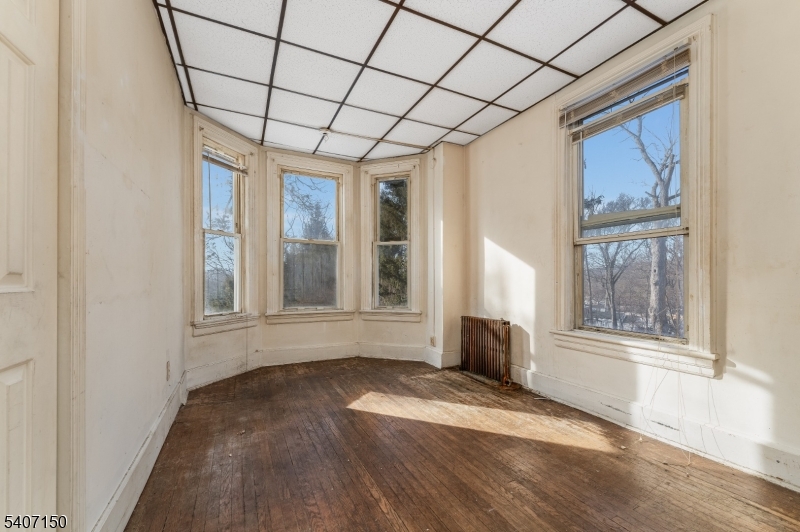 50 Drakestown Road Hackettstown, NJ 07840 - Photo 10 of 47 a view of empty room with wooden floor and fan