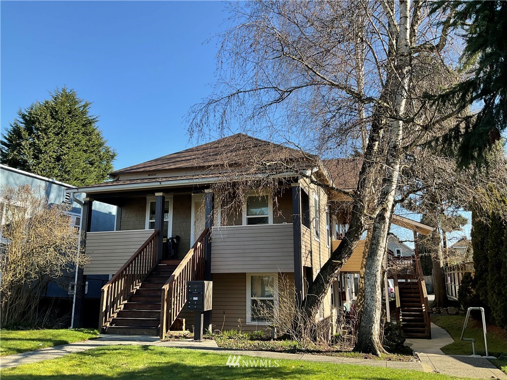 3409 Rockefeller Avenue Everett, WA 98201 - Photo 1 of 31 a front view of a house with a yard