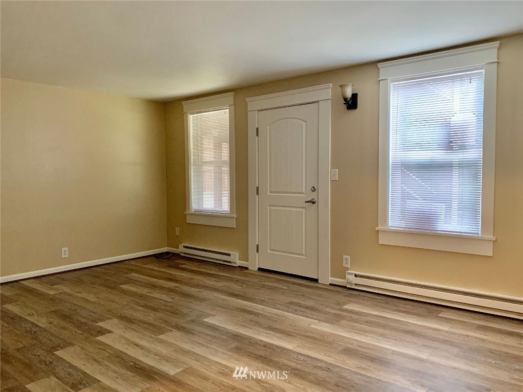 3409 Rockefeller Avenue Everett, WA 98201 - Photo 20 of 31 a view of empty room with window and wooden floor