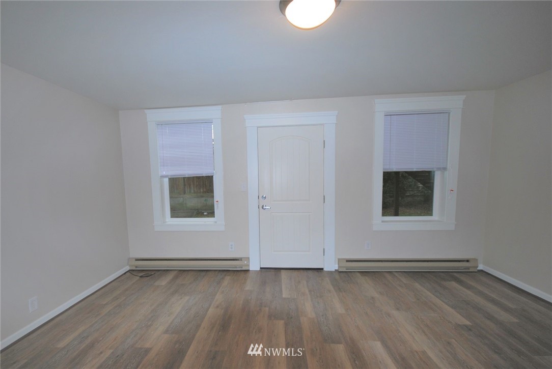 3409 Rockefeller Avenue Everett, WA 98201 - Photo 27 of 31 an empty room with wooden floor and window