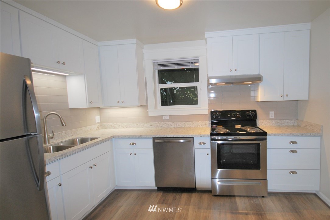 3409 Rockefeller Avenue Everett, WA 98201 - Photo 28 of 31 a kitchen with cabinets appliances and a sink