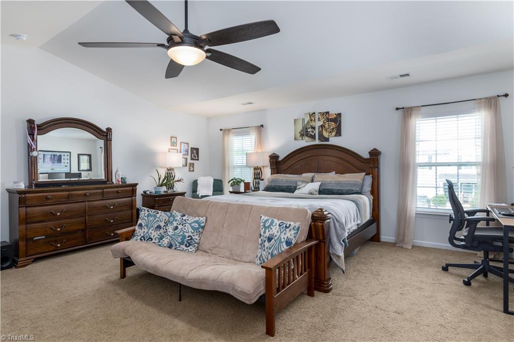1499 Kilstrom Street Rural Hall, NC 27045 - Photo 18 of 28 The primary bedroom is massive! Beautiful vaulted ceiling and ceiling fan.