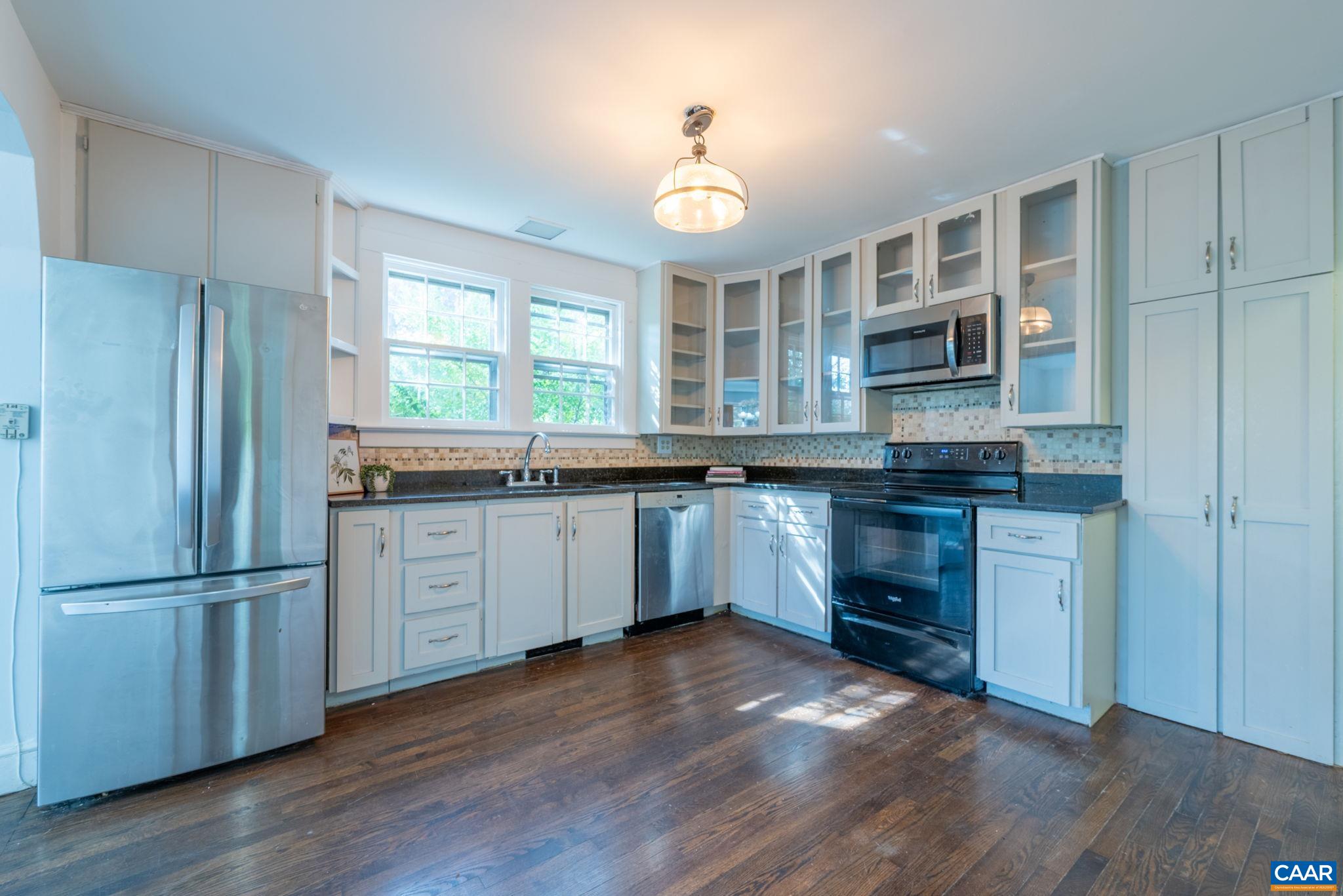 2514 Taylors Gap Road North Garden, VA 22959 - Photo 14 of 75 a kitchen with kitchen island granite countertop a sink cabinets and stainless steel appliances