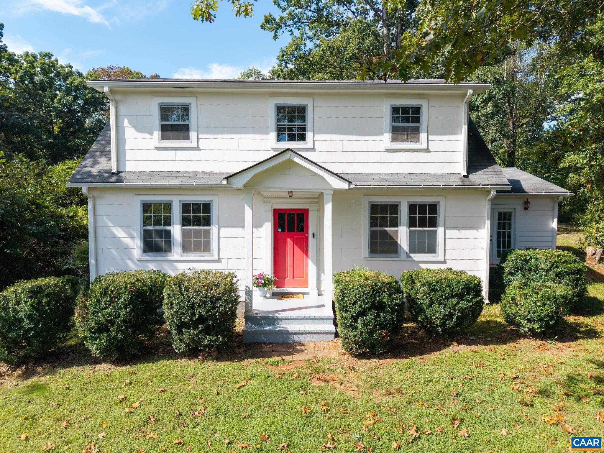 2514 Taylors Gap Road North Garden, VA 22959 - Photo 2 of 75 a front view of a house with a yard and potted plants