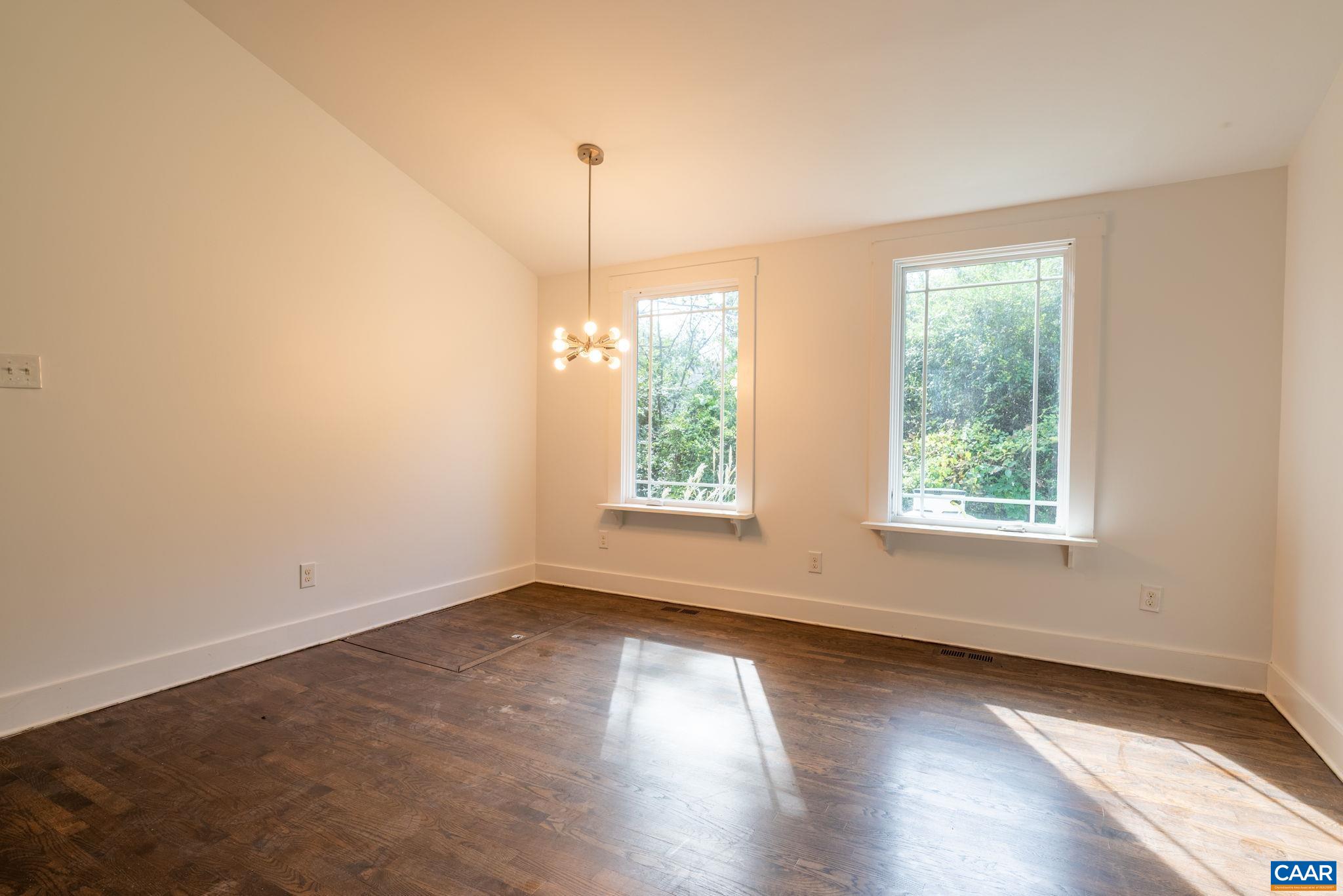2514 Taylors Gap Road North Garden, VA 22959 - Photo 25 of 75 a view of an empty room with wooden floor and a window